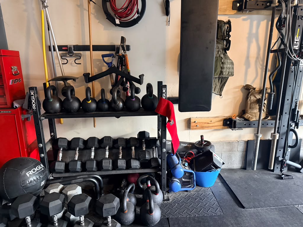 Racks of kettlebells, dumbbells and a medicine ball